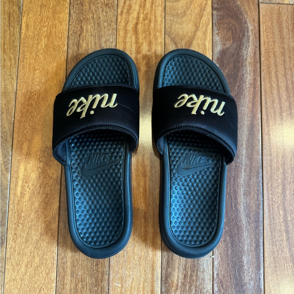 Nike Black Slides with Gold Logo